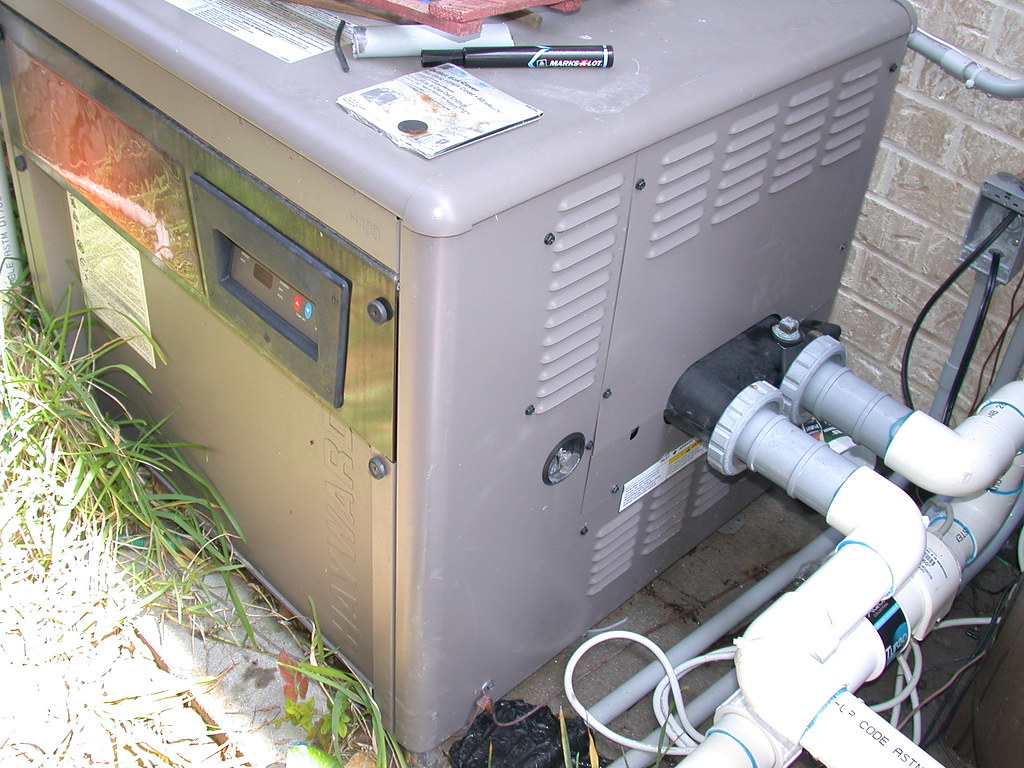 Pool heater service equipment next to residential plumbing